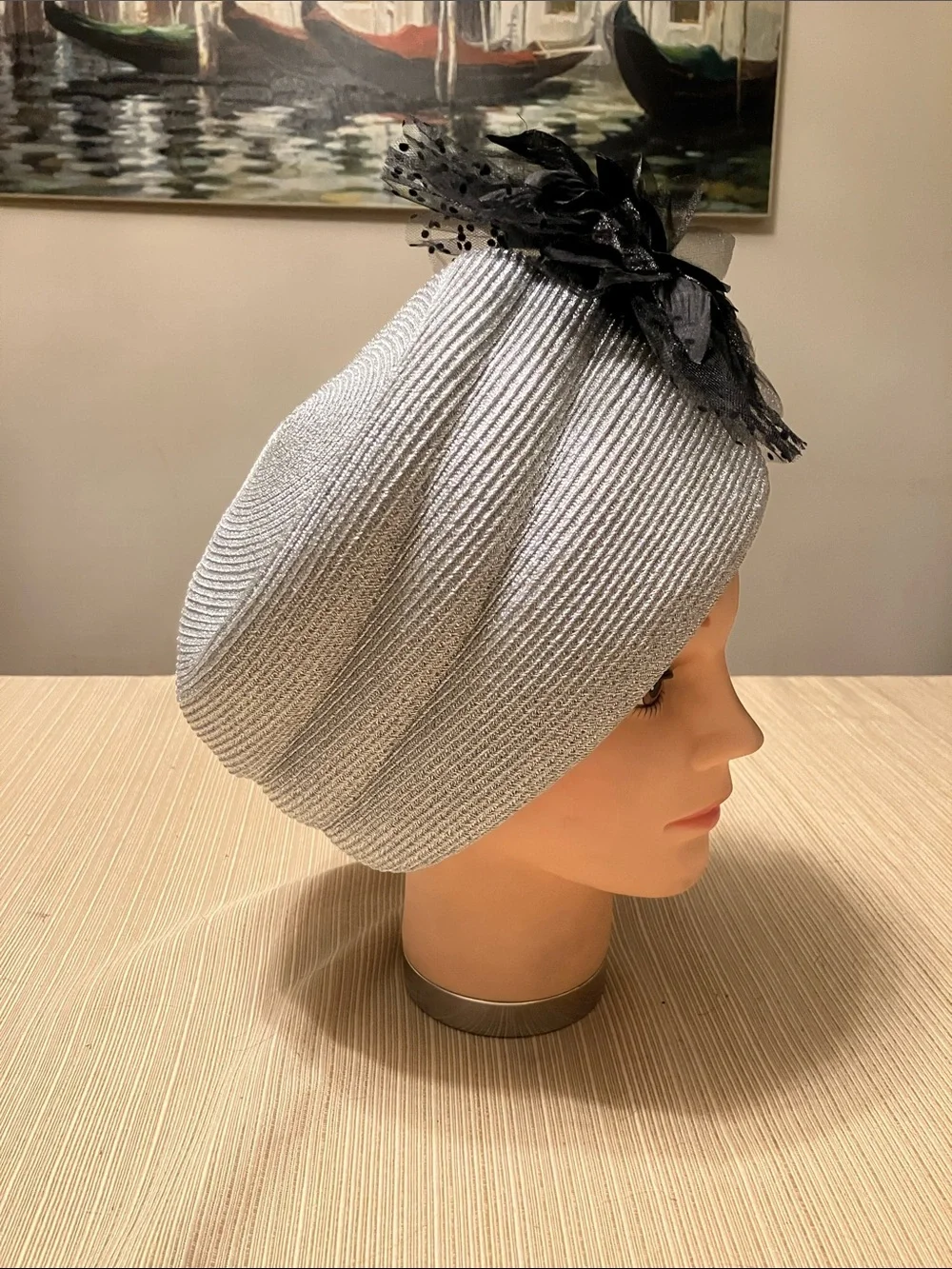Elegant Metallic Silver Hat with Black Floral Accent